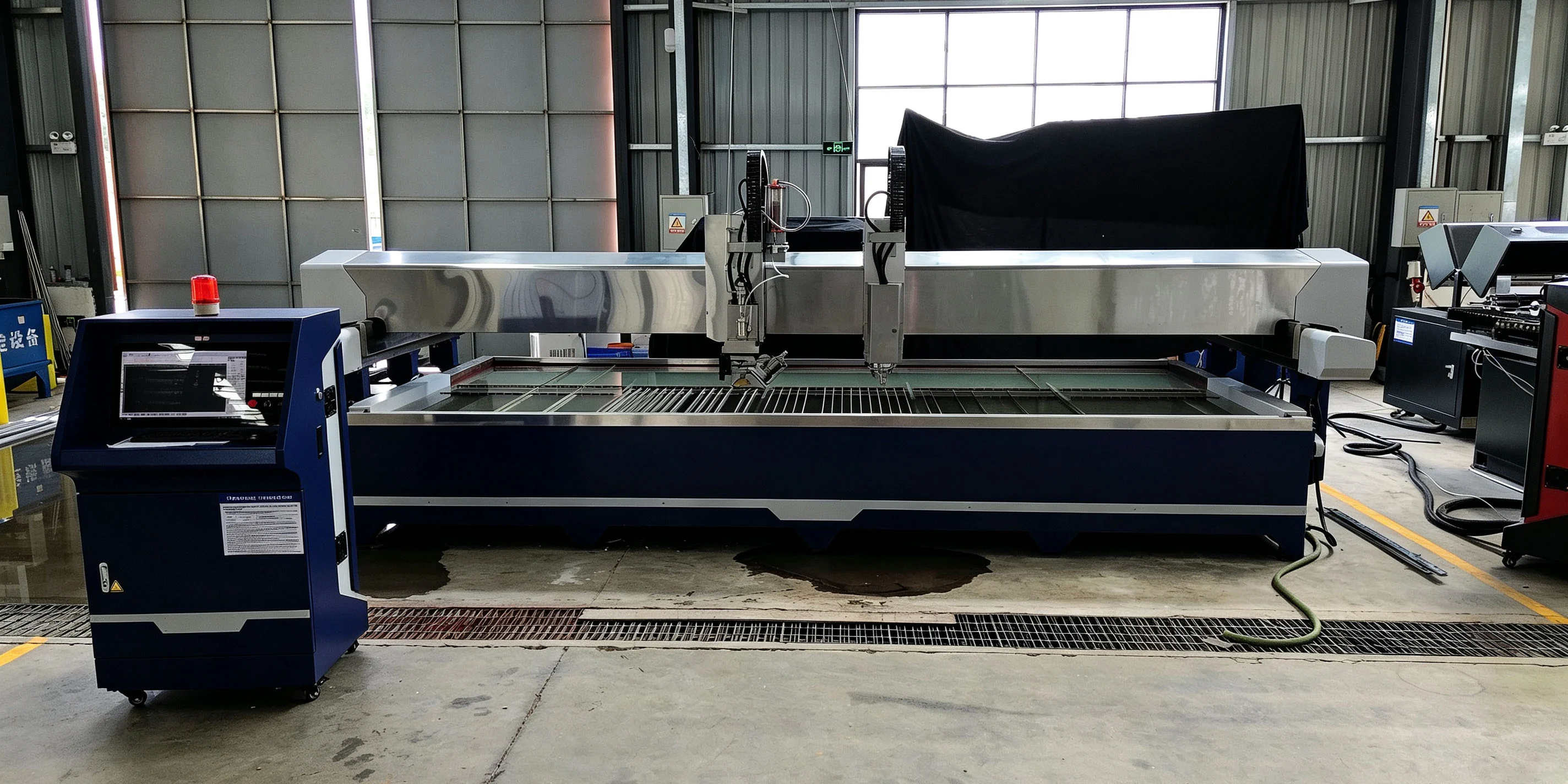 Rich AC 5-axis waterjet with milling carriage on the factory floor in Foshan